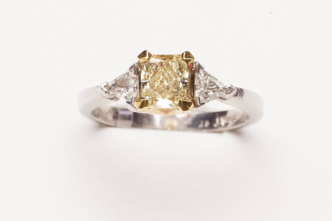 PLAT/18KT .78CT RAD SI1 FANCY YELLOW W .25CTTW TRILL
