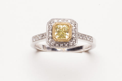 Lady's Two-Tone Prong Set Fashion Ring With 52=0.31Tw Round Diamonds And One 0.37Ct Princess Cut Yellow Diamond