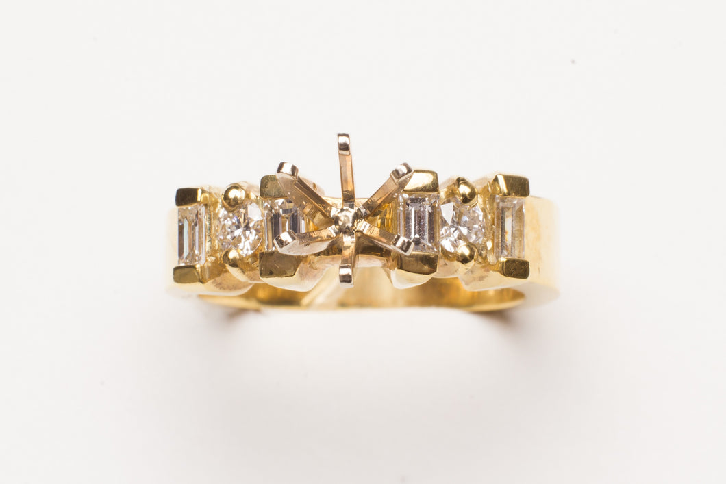 SEMI DIA .64CT TW18KT YG  RING 2BGT&1RD EACH SIDE